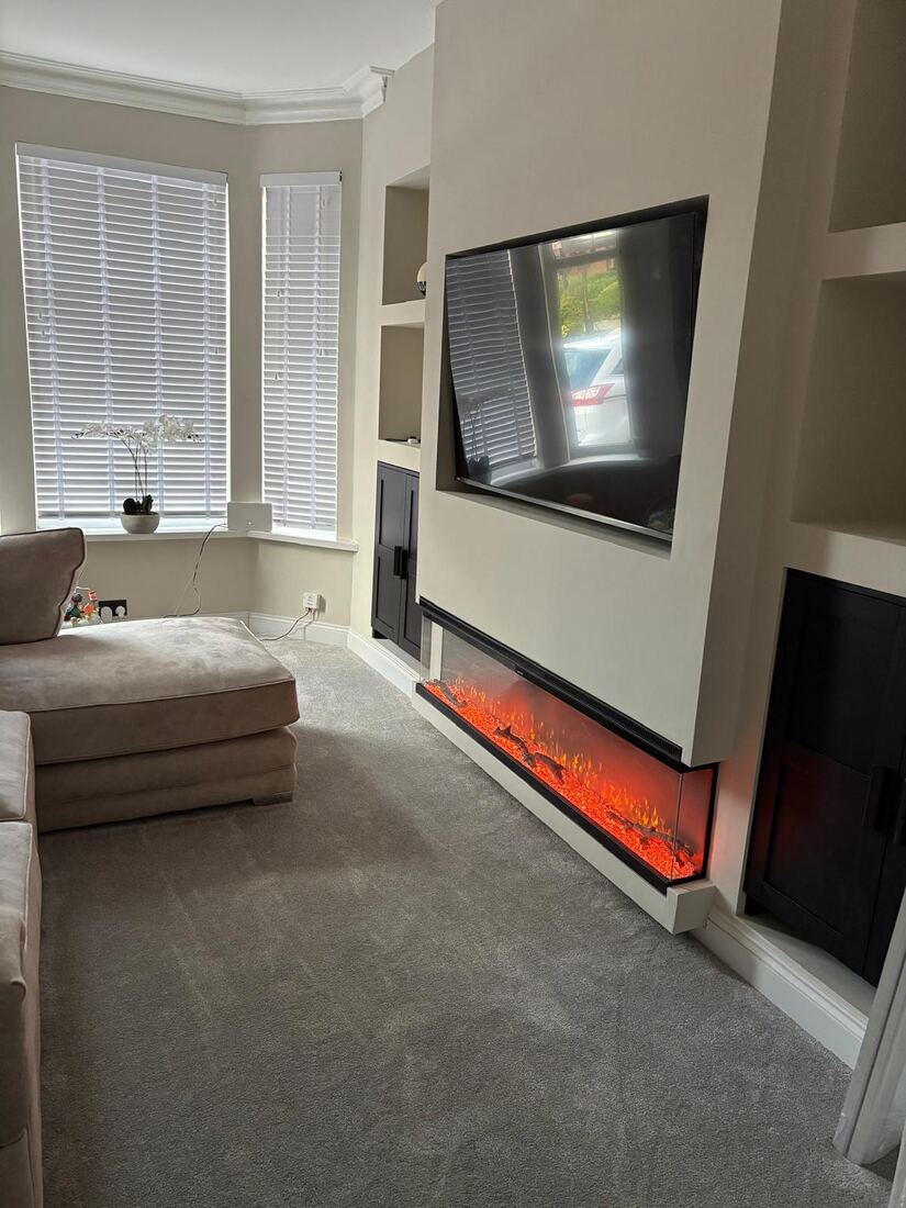 Finished media wall with recessed TV, electric fire and LED spotlights